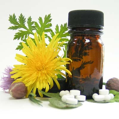 Homeopathic white pills and a bottle